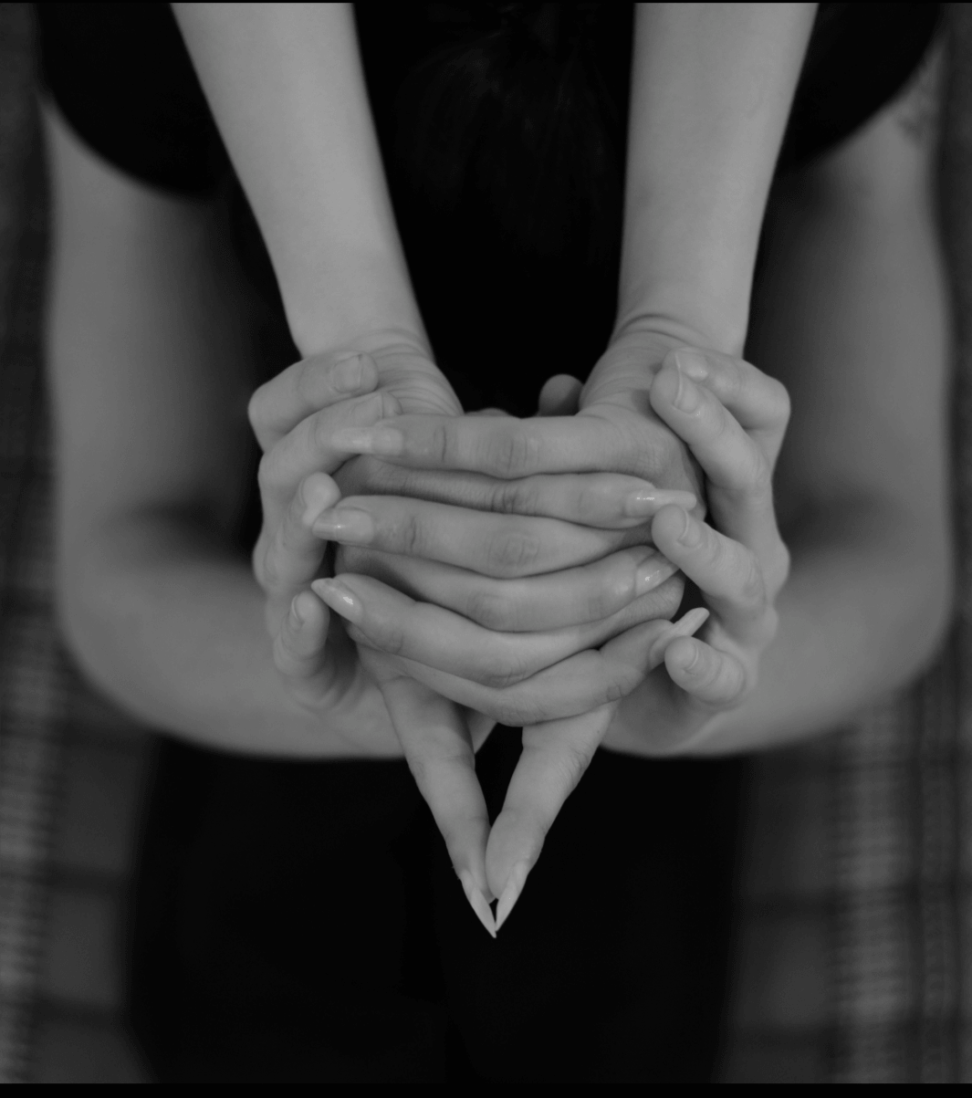 Holly's hands supporting a student's hands